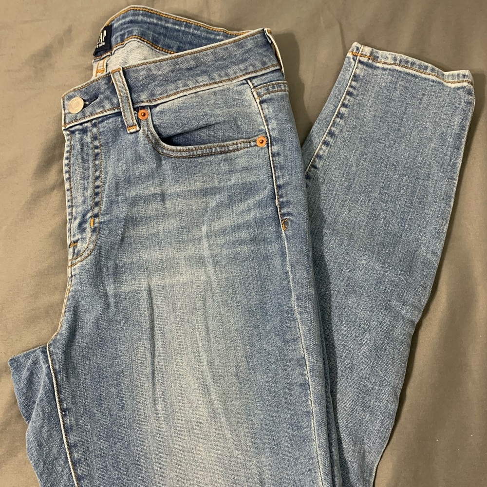 Blue jeans with distressing